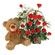 Teddy Bear & Roses. A charming teddy bear and and arrangement of tender red roses with greens in basket.. Sochi